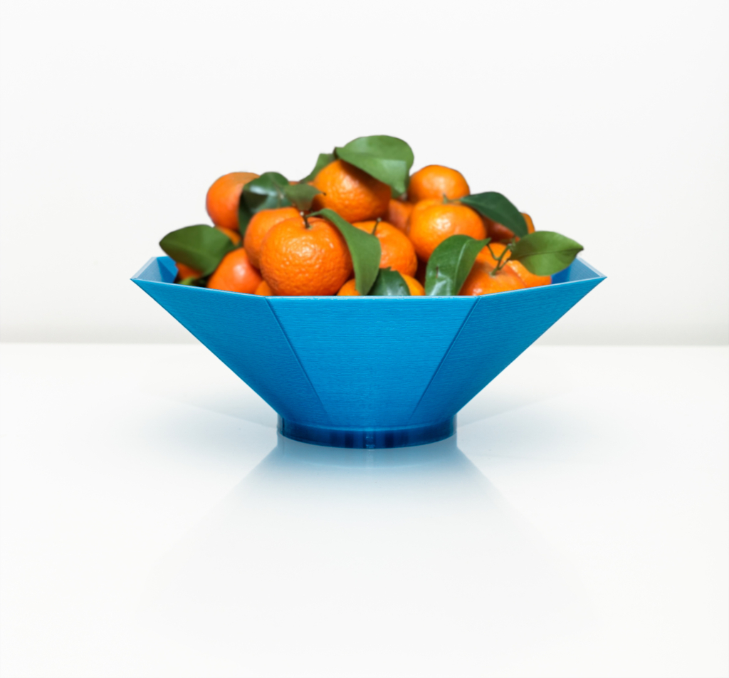 Image of a 3D printed fruit bowl filled with mandarines